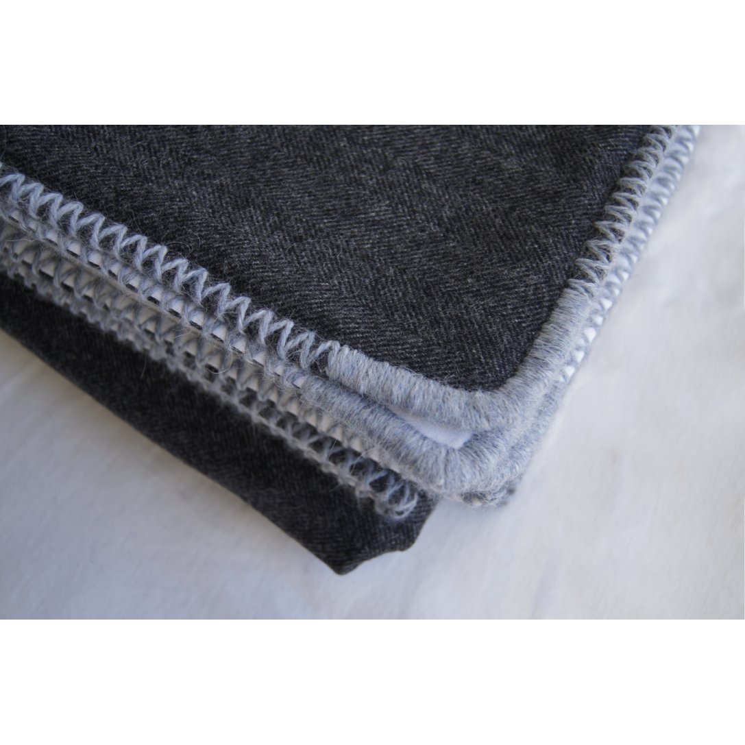 Handmade herringbone pattern wool & white sateen blanket with hand-embroidered edging